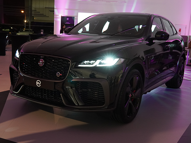 Black F-PACE SVR with headlights on